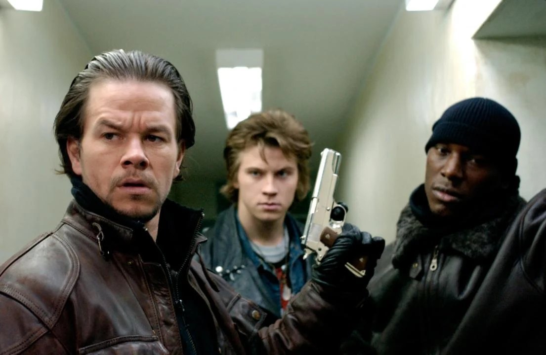 Official film still — the Mercer brothers indoors for Four Brothers