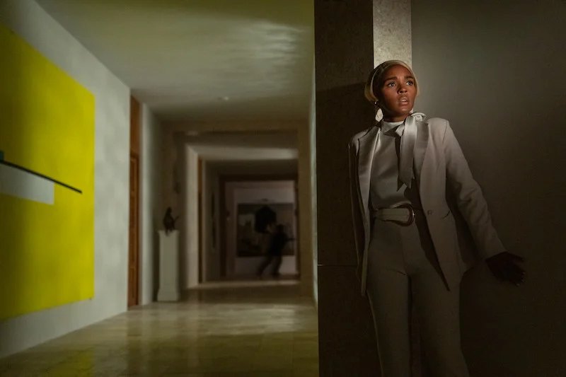 Official film still — Andi Brand in the hallway for Glass Onion: A Knives Out Mystery